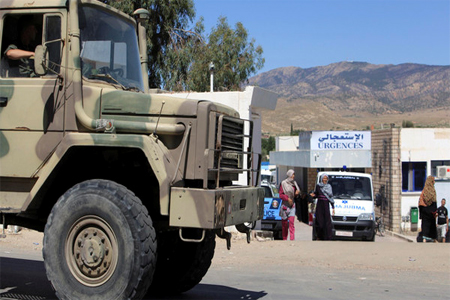 A Tunisian military truck parks outside the hospital of Kasserine, near the Algerian border, Thursday, July 17, 2014. (AP)