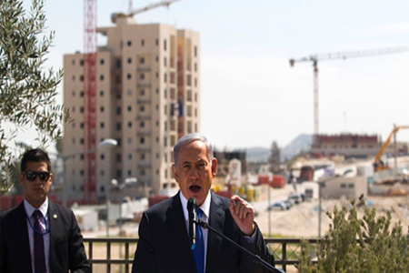 Israeli Prime Minister Benjamin Netanyahu delivers a statement in front of new construction in the Jewish settlement known to Israelis as Har Homa and to Palestinians as Jabal Abu Ghneim in an area of the West Bank that Israel captured in a 1967 war and annexed to the city of Jerusalem, March 16, 2015. (Reuters/Ronen Zvulun)