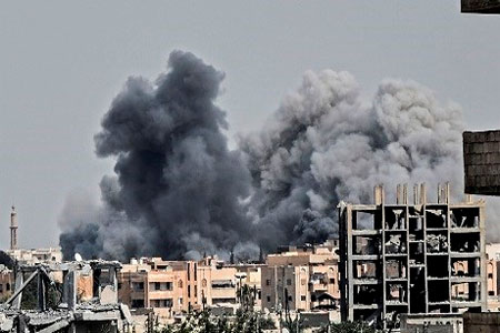 In this file photo taken on July 17, 2017, heavy smoke billows following an airstrike on the western frontline in Raqqa, during an offensive by the US-backed Syrian Democratic Forces to retake the city from Islamic State (ISIS) group fighters. File photo: Bulent Kilic/AFP