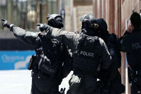 Media caption Acting Deputy Commissioner Neil Gaughan: "It is alleged both men were undertaking preparations for a terrorist attack which included targeting police officers"