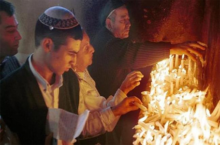 Jewish pilgrims light candles inside the shrine at the site of the 120 year-old tomb of Rabbi Abu Hatzeira northwest of Cairo, Egypt. (Photo courtesy: Associated Press