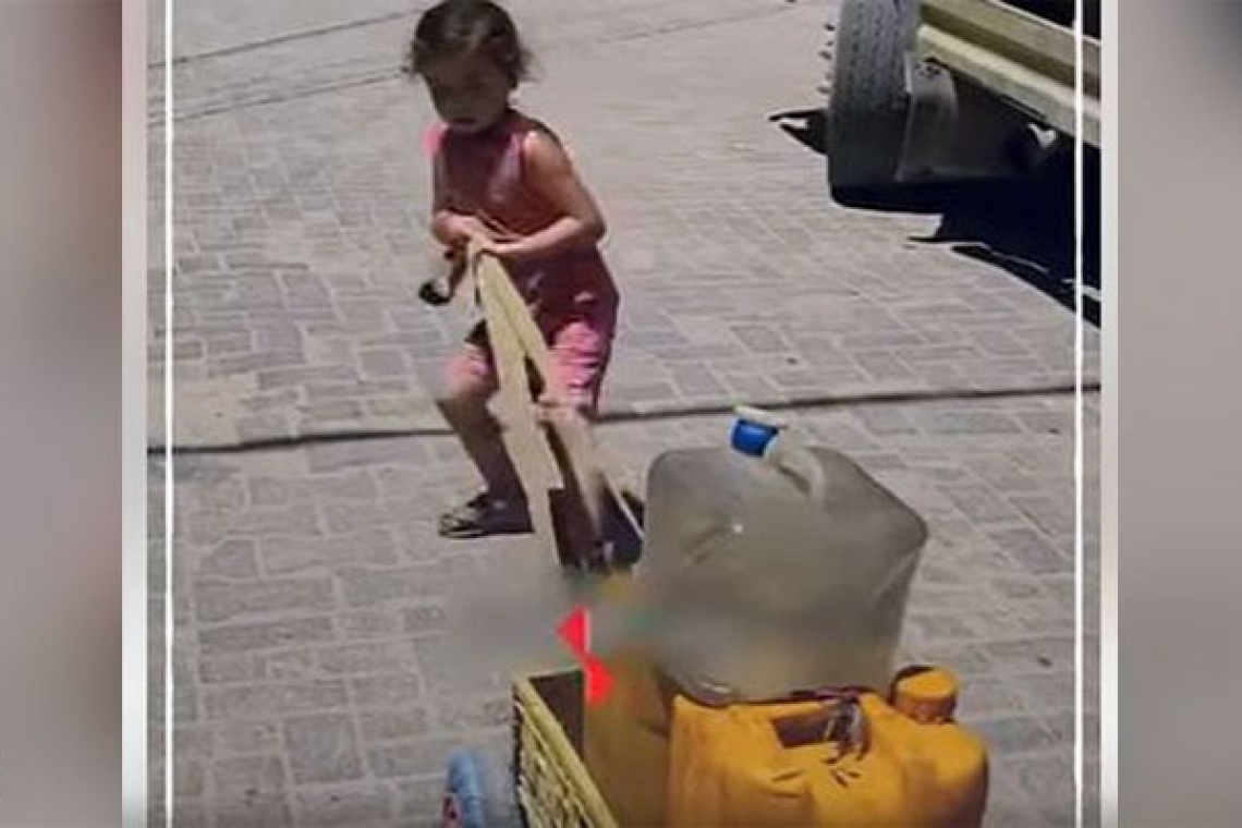 A child carries the weight of a thirsty city... And a mother who graduated before her son 